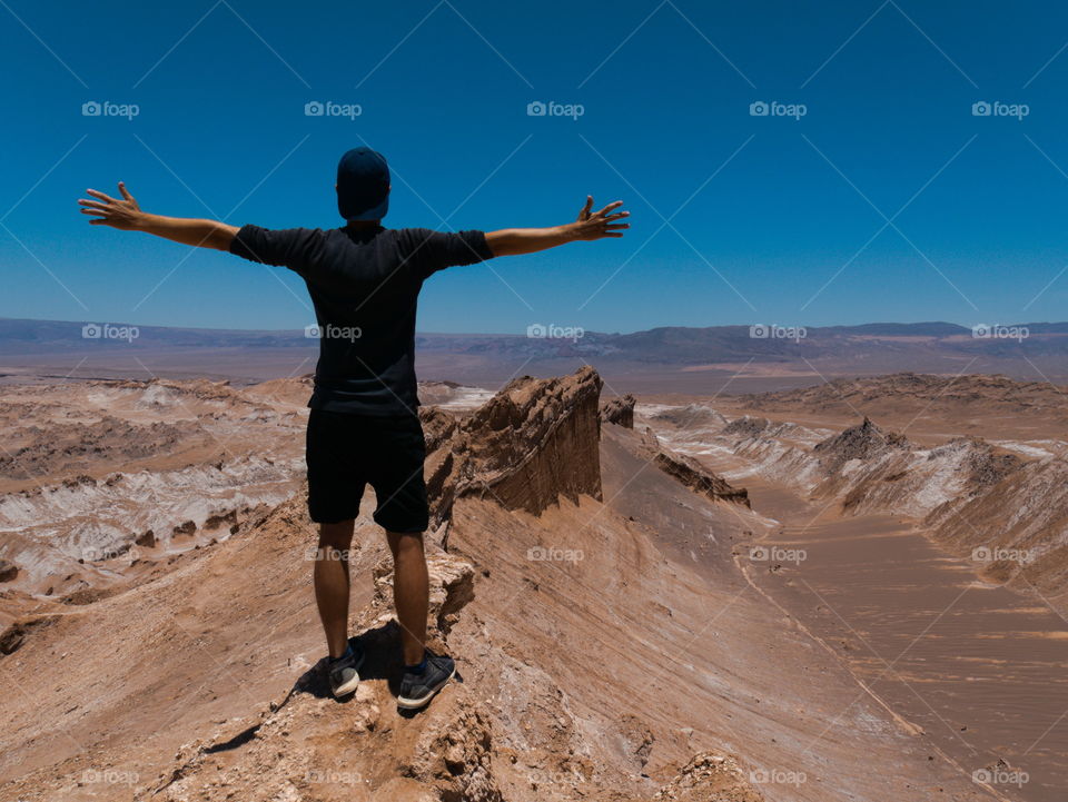 Man enjoying his view over Atacama desert in Chile
