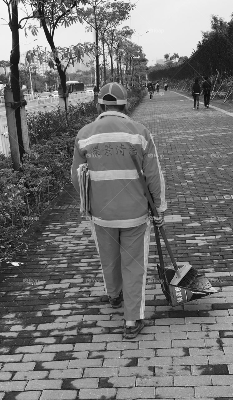 Chinese Street Cleaner in Shenzhen, China - Black and White