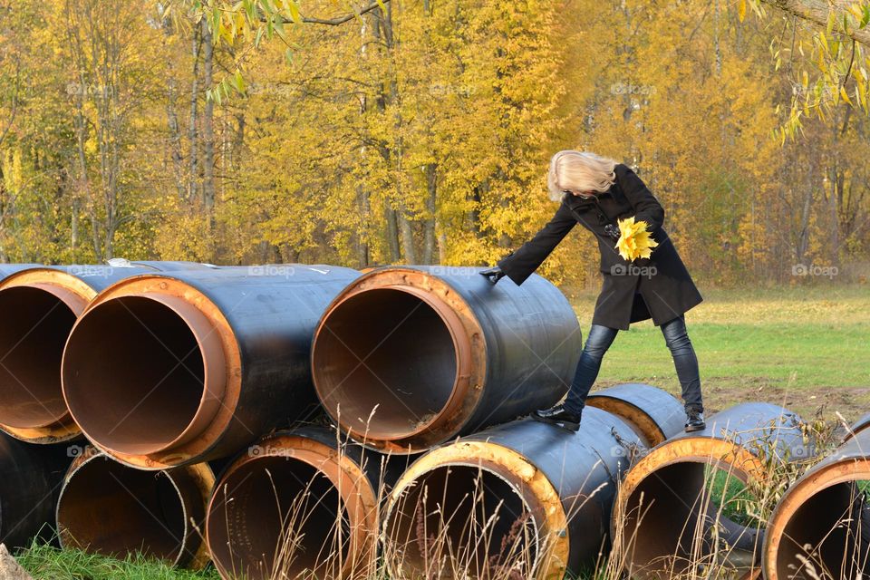 round tubes and woman autumn landscape