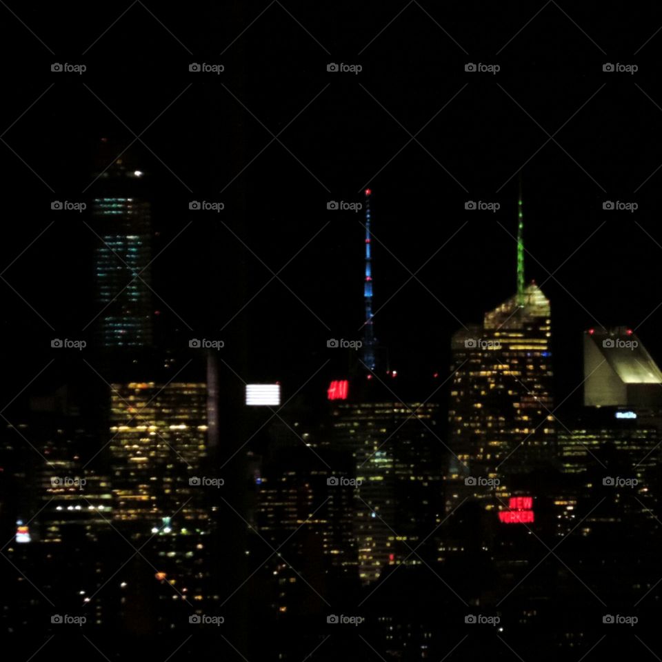 New Yorker. Part of the Manhattan skyline by night