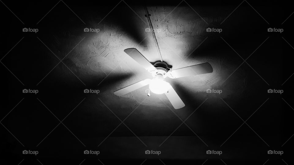 Ceiling fan illuminating darkness