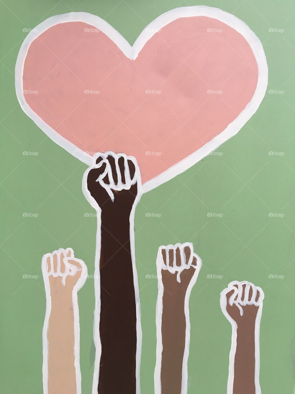 Unity artwork of hands holding pink heart 