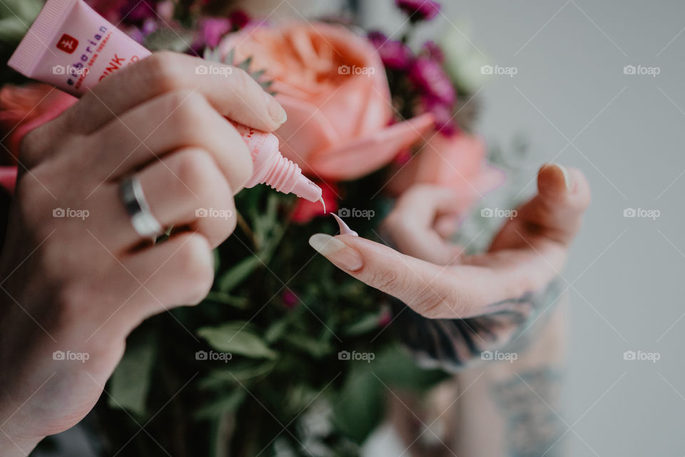 skin care product and flowers