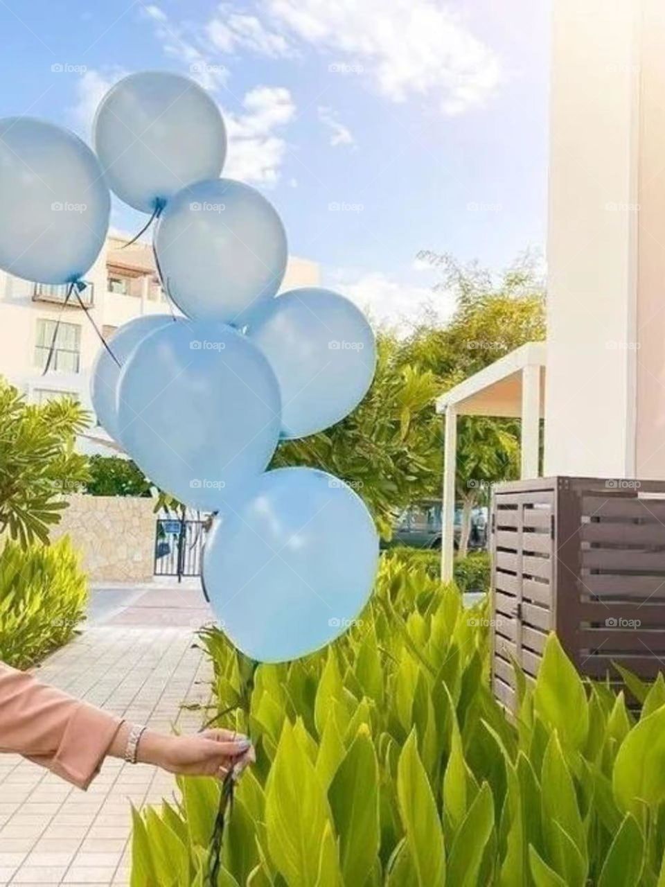 Sending blue balloons to the blue sky