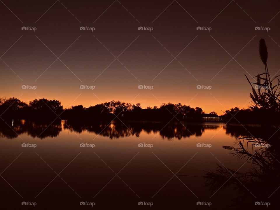 Orange Glow from warm setting sun on a very clear afternoon setting through Twilight then heading into night. 