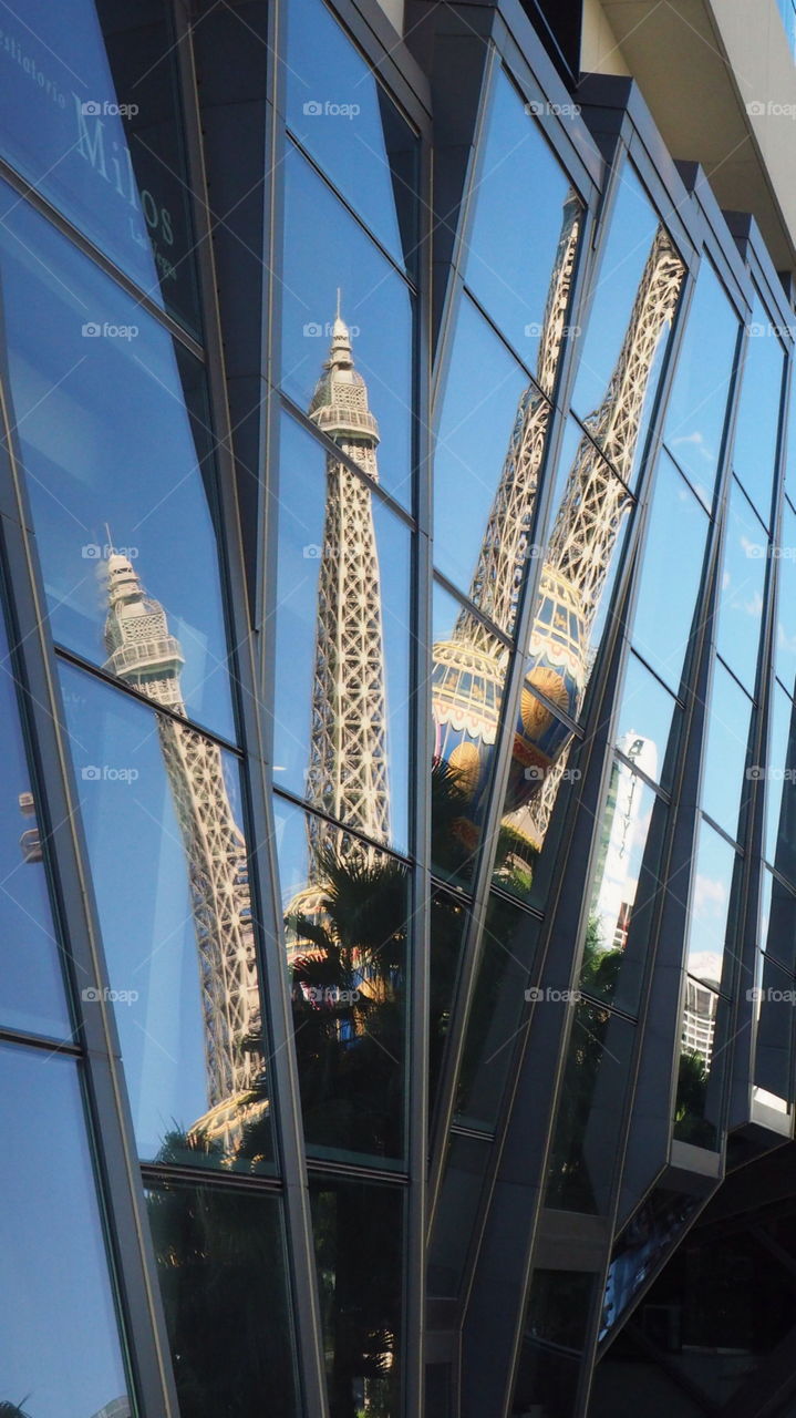 Eiffel tower reflection. French Eiffel Tower reflected multiple times iconic 