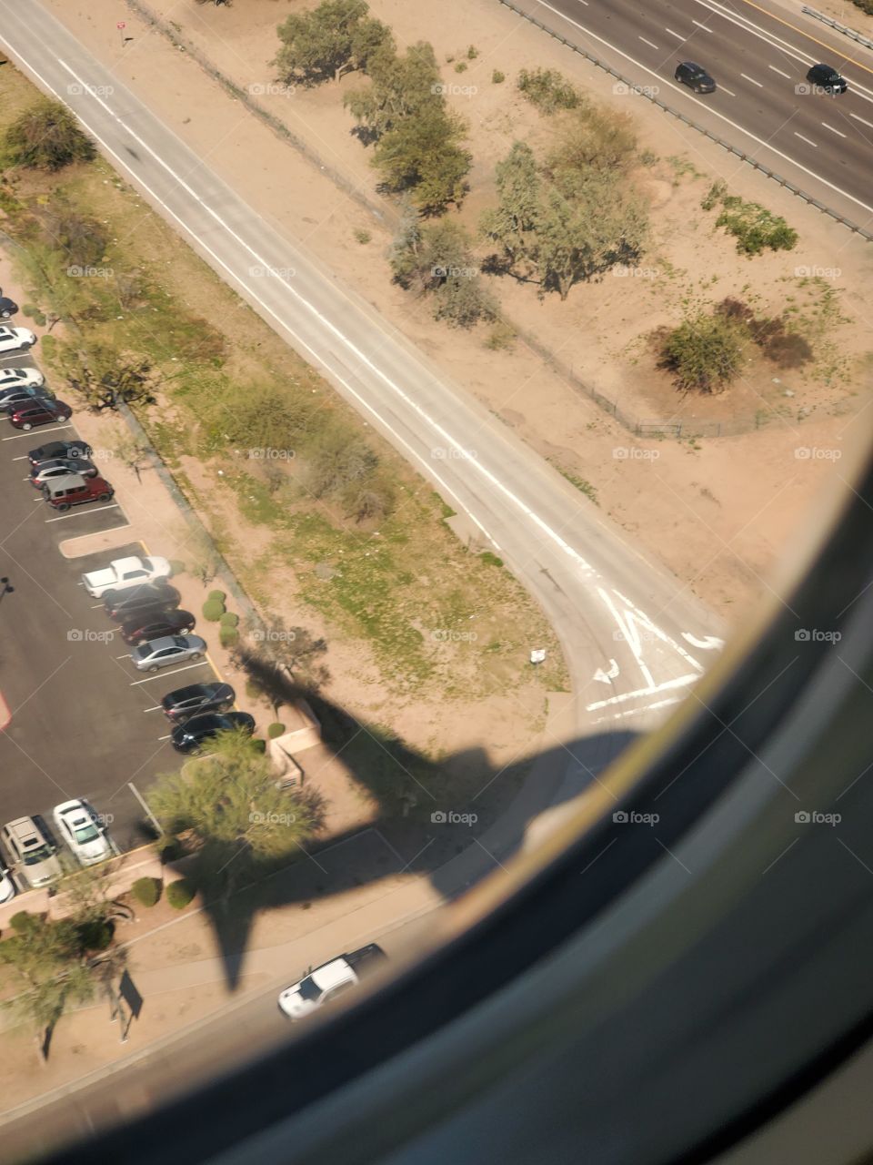 reflection of the airplane I'm on while approaching the runway