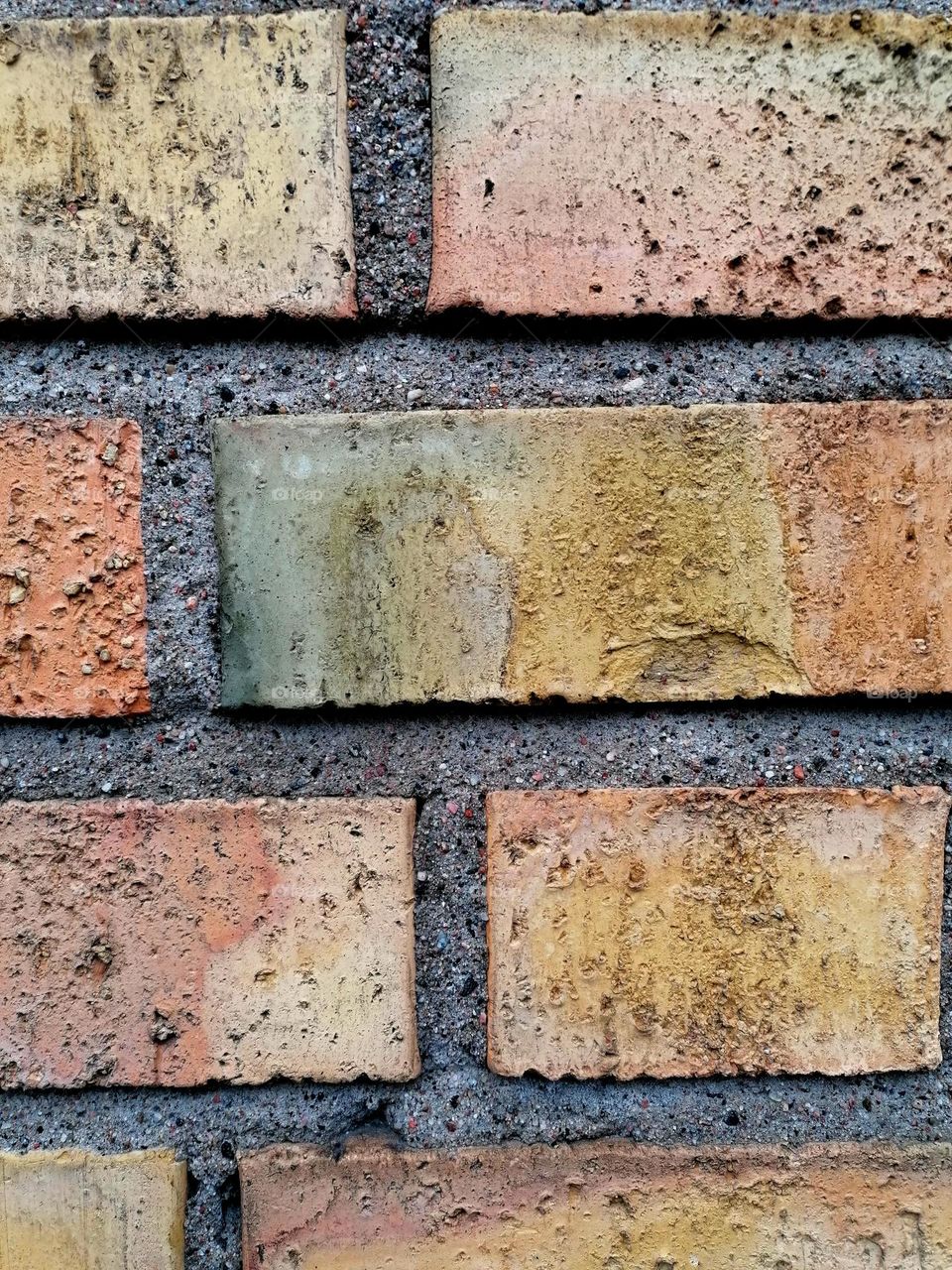 Patinated colorful rectangular old bricks