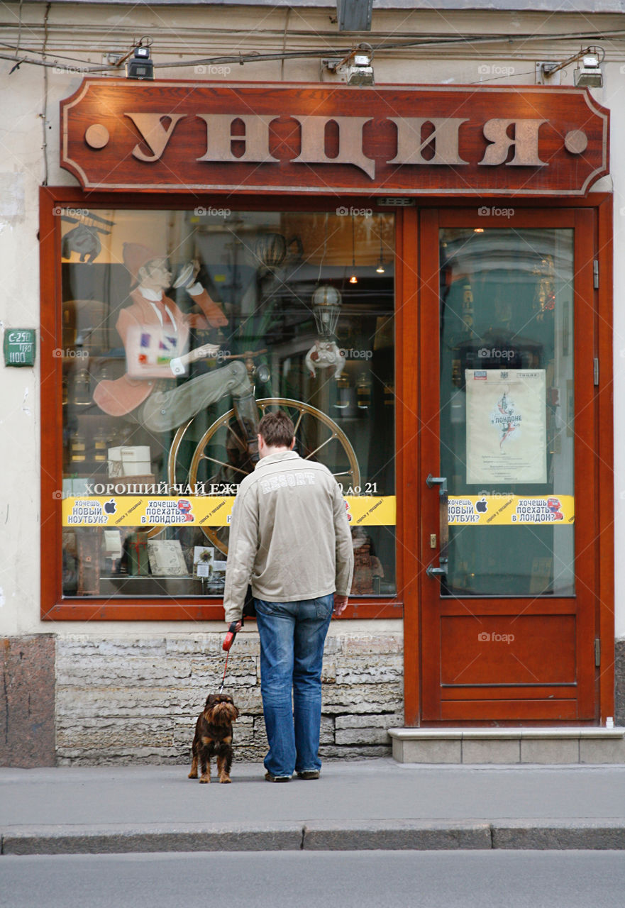 Man with a dog in the city 