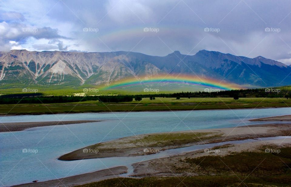 Double rainbows above the lake 