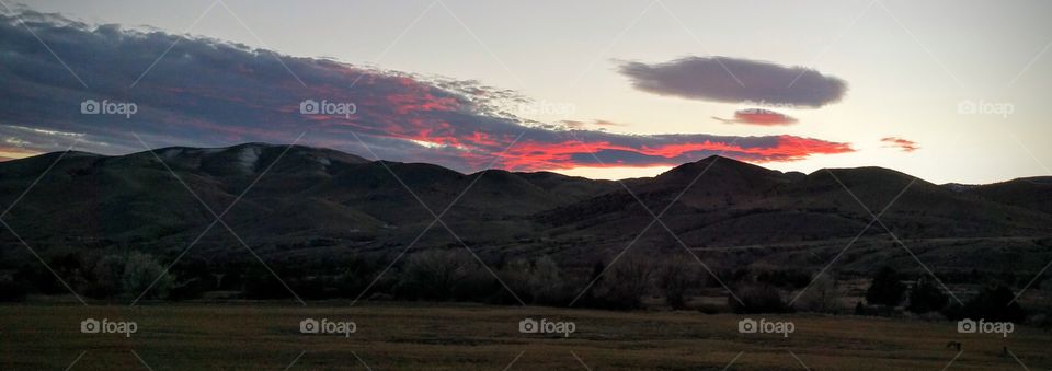 red sky at night over the mountains