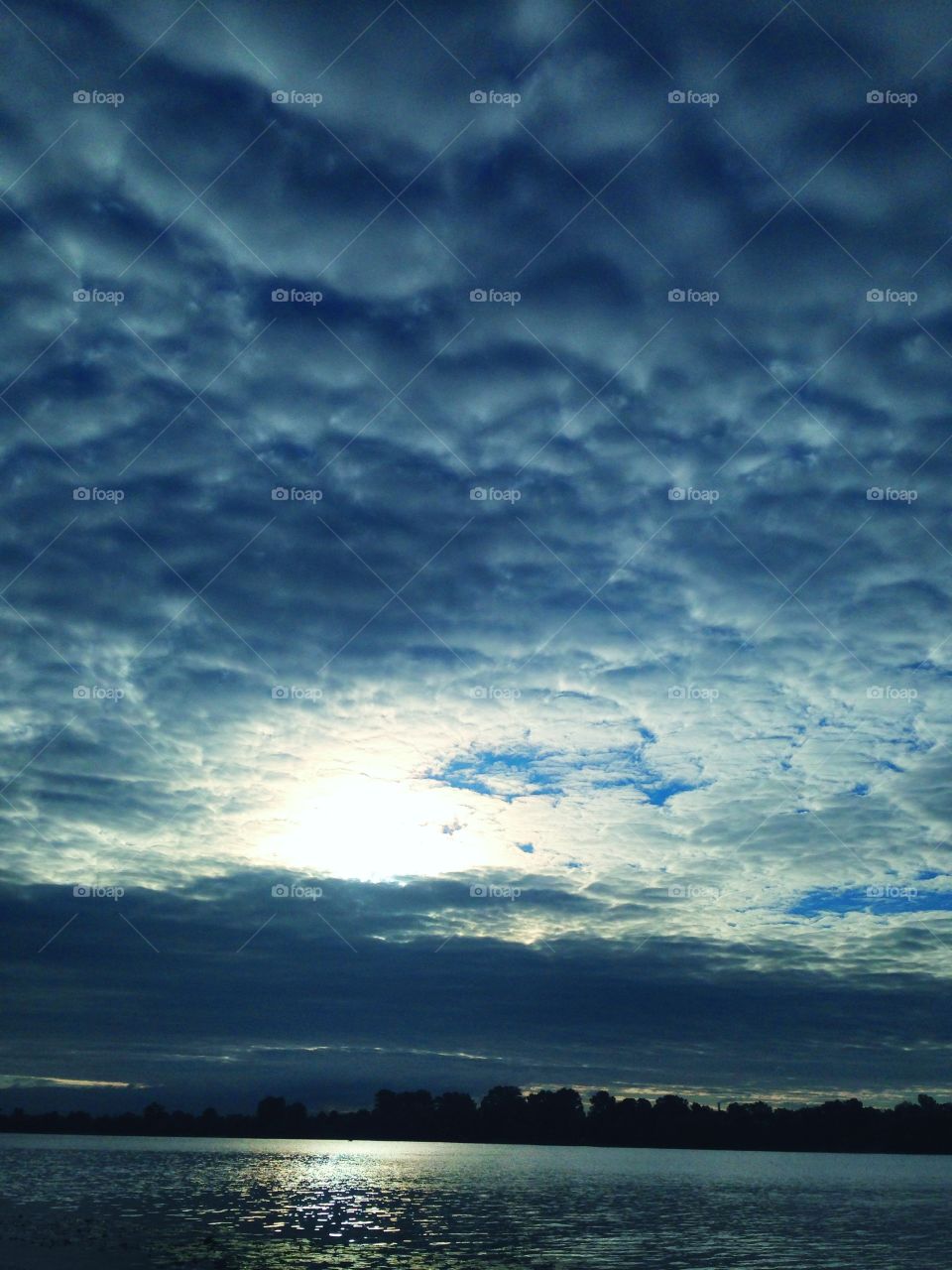 the sun hid behind the clouds summer day