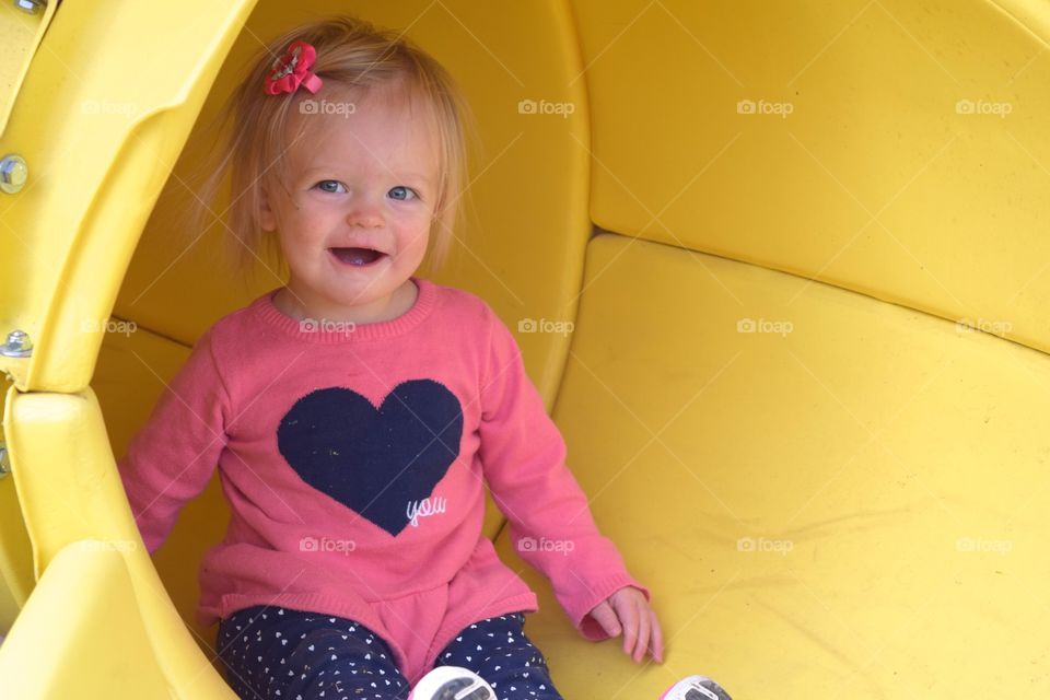Cute girl playing on slide