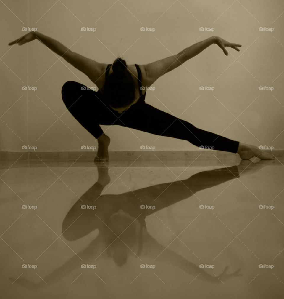 Yoga extension pose. Reflection on a marble surface of a yoga extension exercise