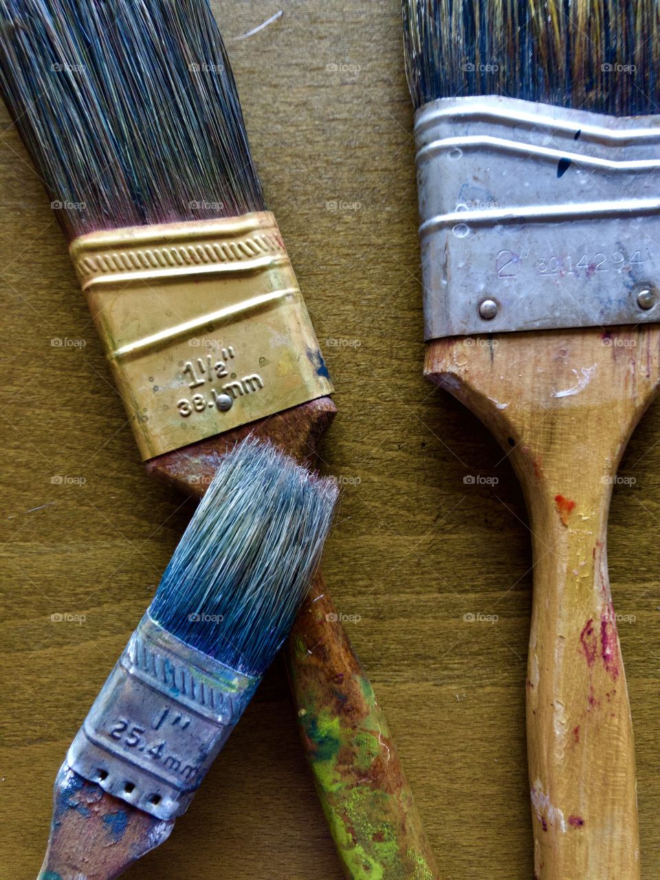 Used paintbrushes on drafting table 