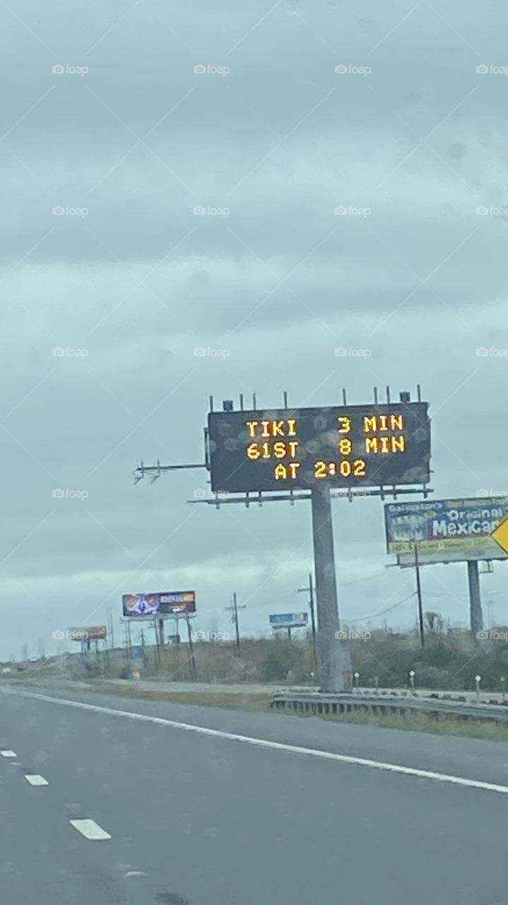 Elevated Road Signs give motorist info on destinations to Galveston Island. 