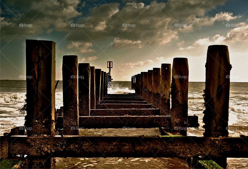 Weathered wooden pier at sea