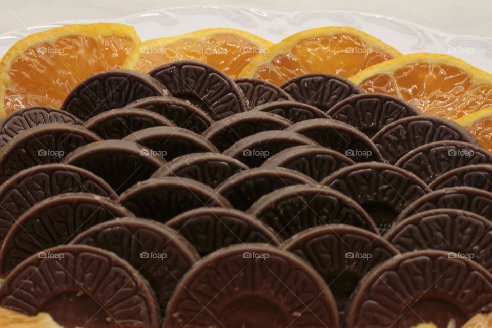 Chocolate and orange slices close-up