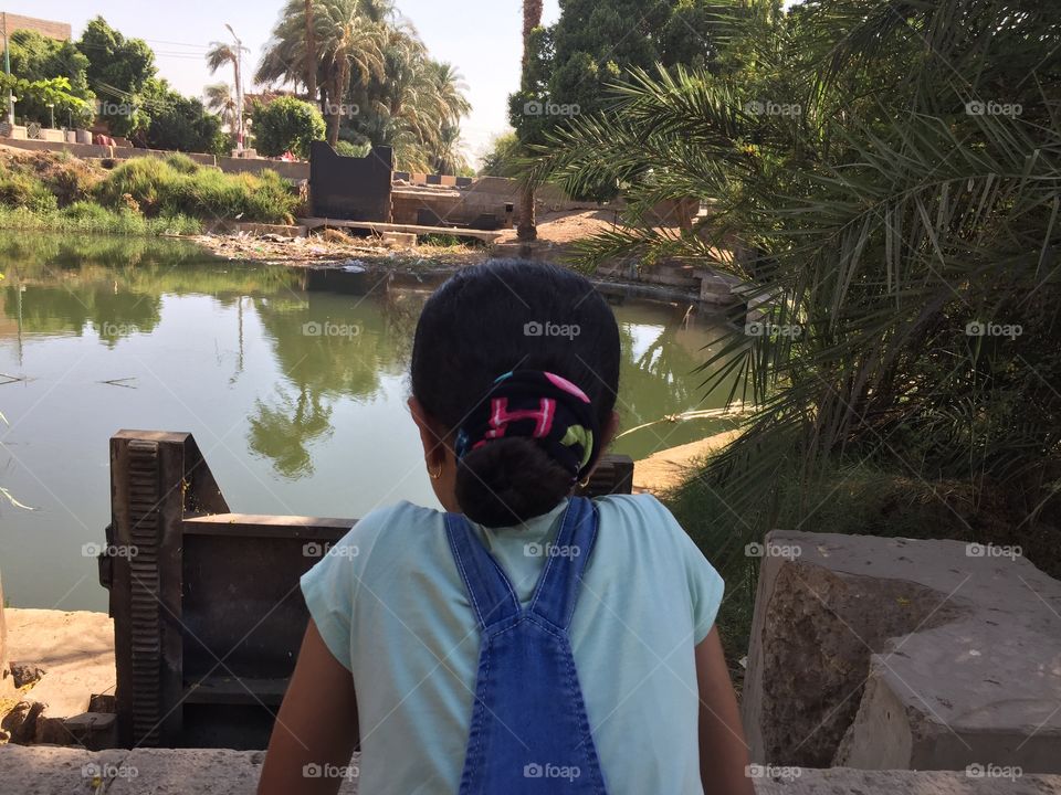 A little girl has a look to the beautiful nature