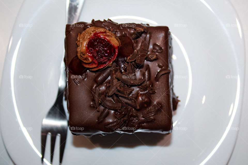 Chocolate mousse with raspberries on a white plate