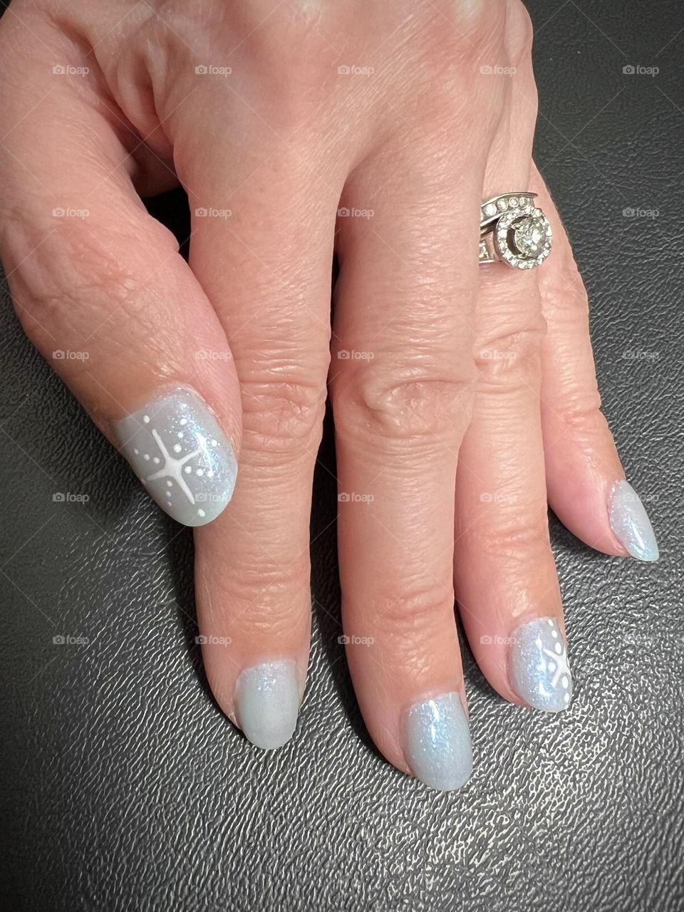 Pretty soft blue snowflake/star nails