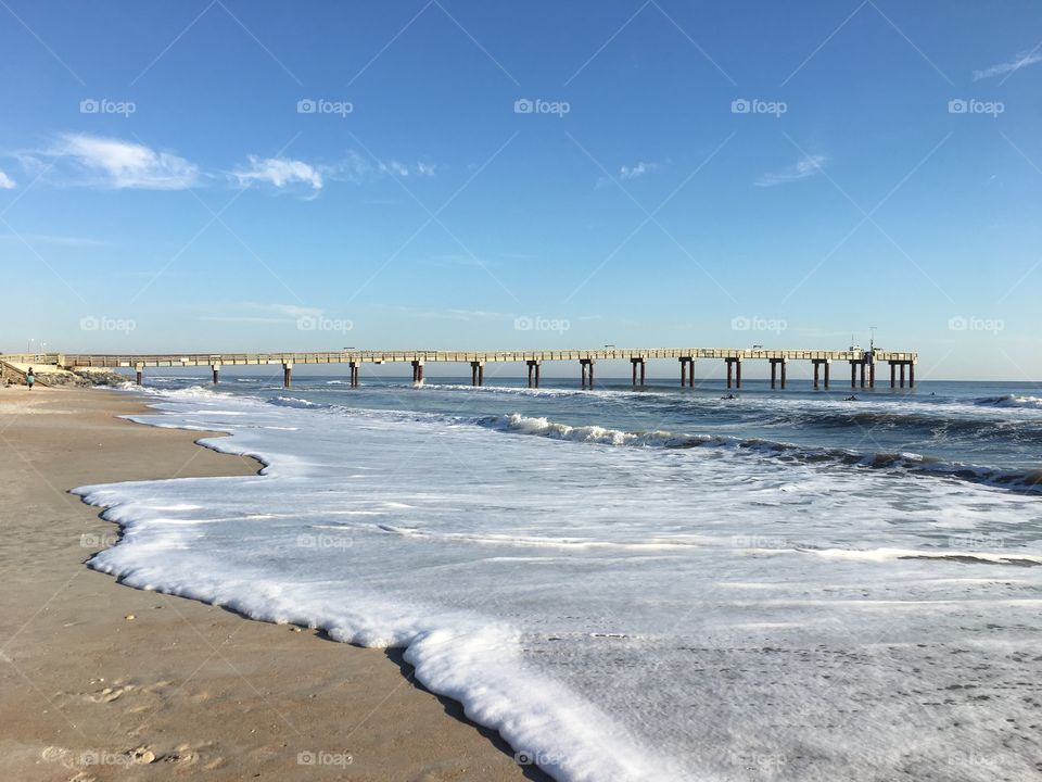 Beach seascape with pier