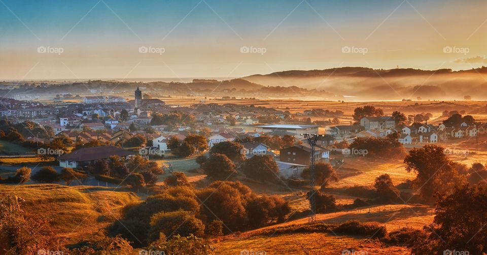 Early morning fog in small village 