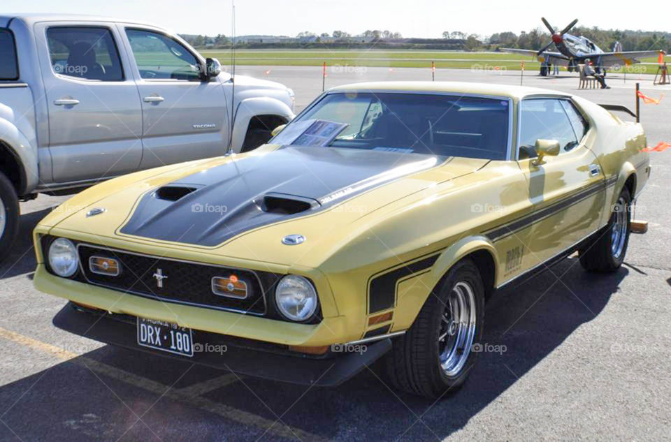 Muscle car. Hot yellow and black muscle car at a local car show