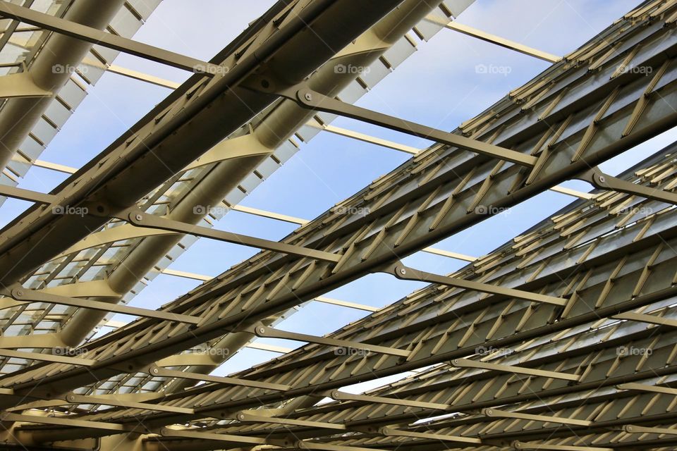 Metal construction on the blue sky background 
