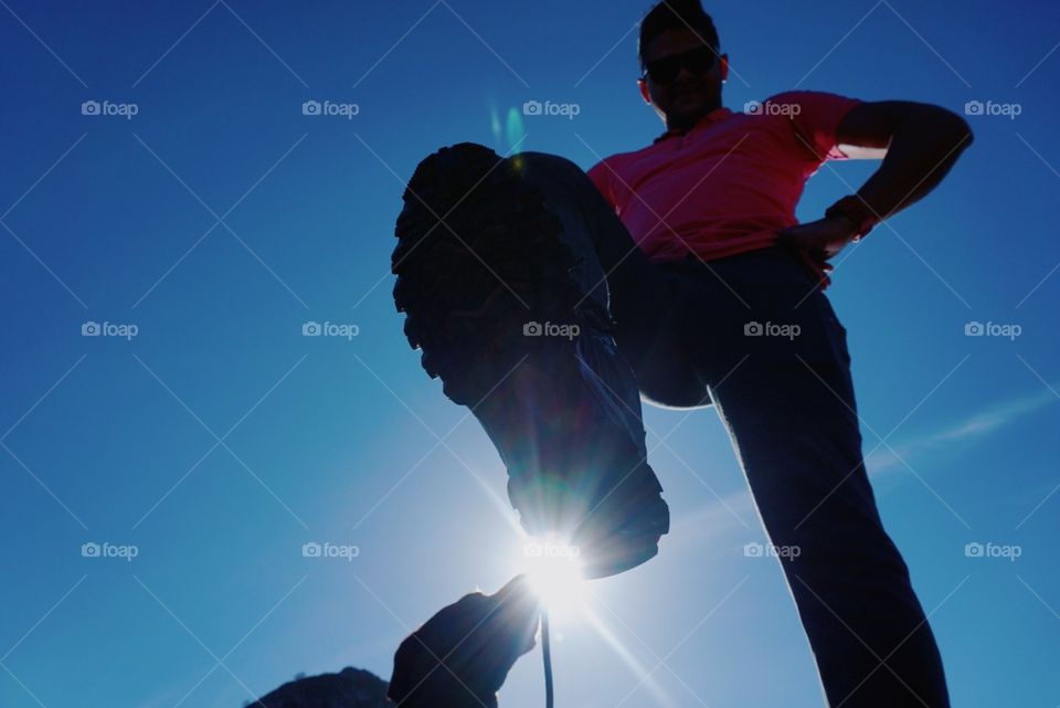 Sky#sun#shoe#dog#human#perspective#vertical