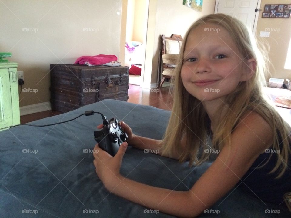 Little girl playing xbox one