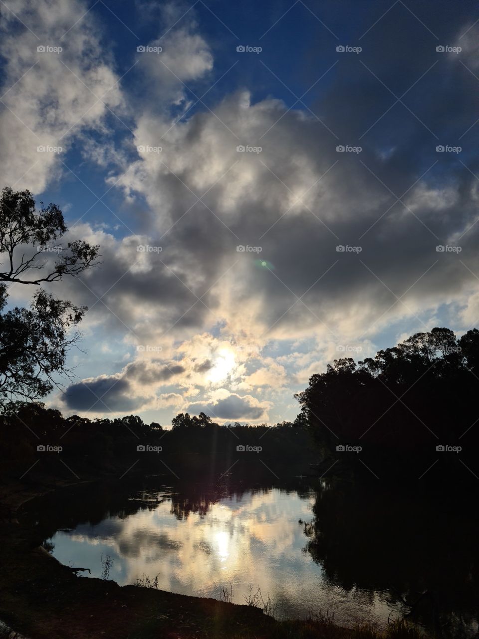 Cloudy serene late afternoon by the river