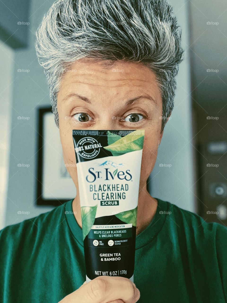 Hair is the best accessory, gray hair trend, woman with gray hair poses with brand name, gray hair don’t care, woman posing with product, focus on the hair 