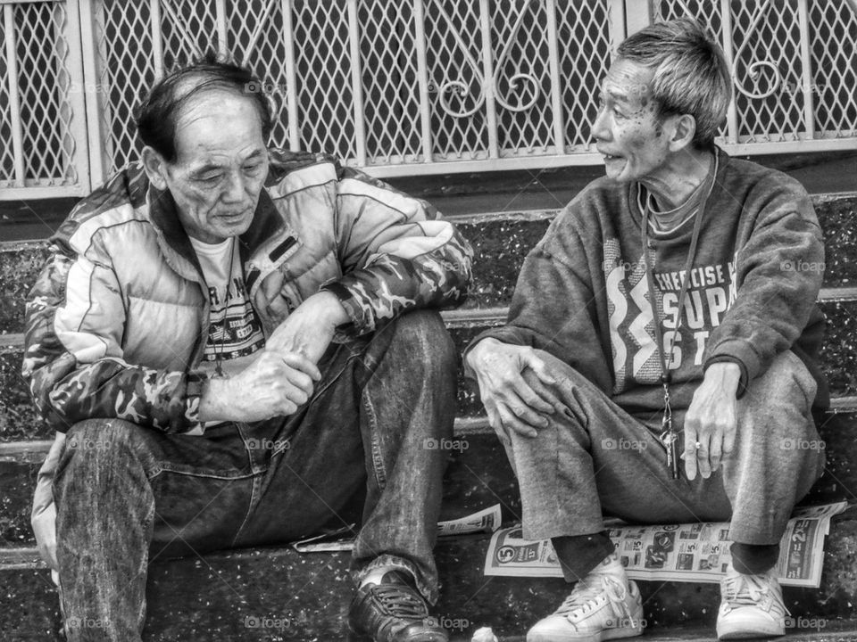 Two Old Men Sharing Thoughts. Old Friends Deep In Conversation
