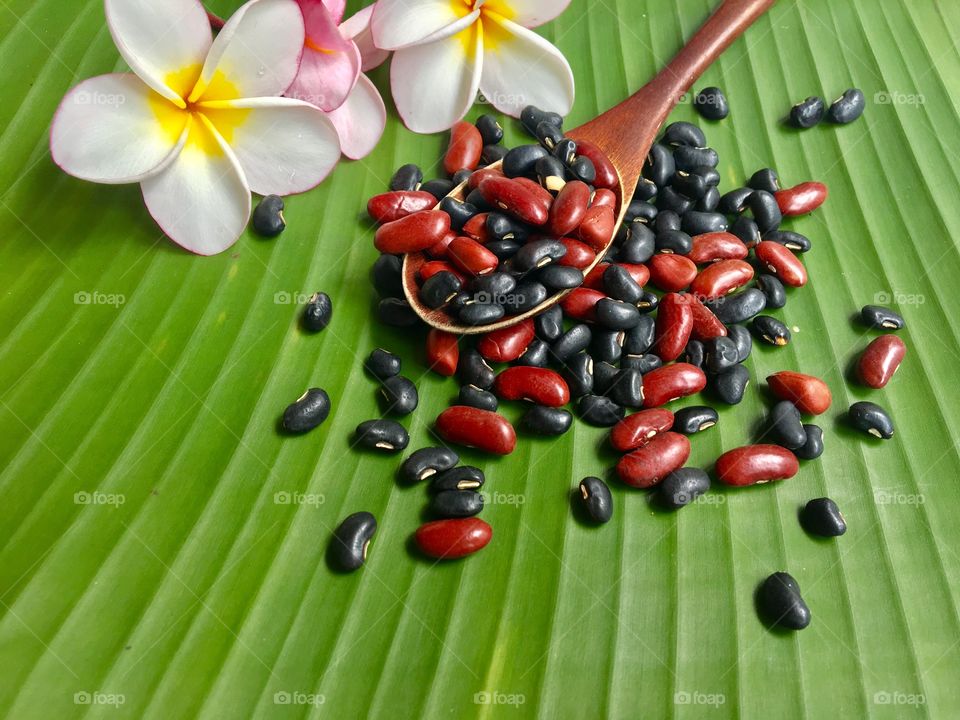 Nuts red and black on spoon