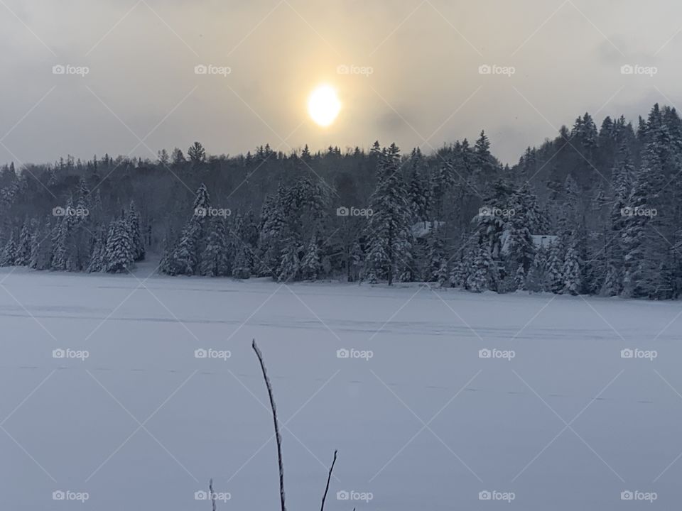 Winter 2021; Beautiful sunrise on the lake in the Laurentians, Quebec, Canada 🍁