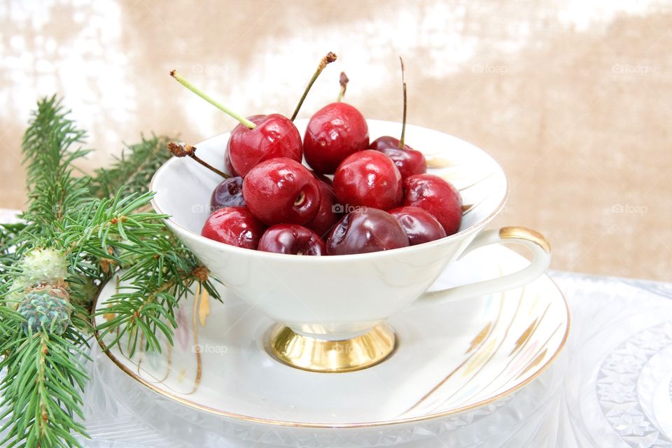 cherries in teacup