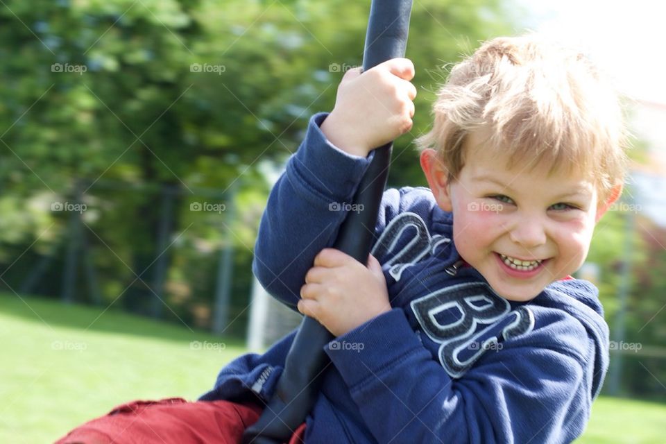 Young boy on swing