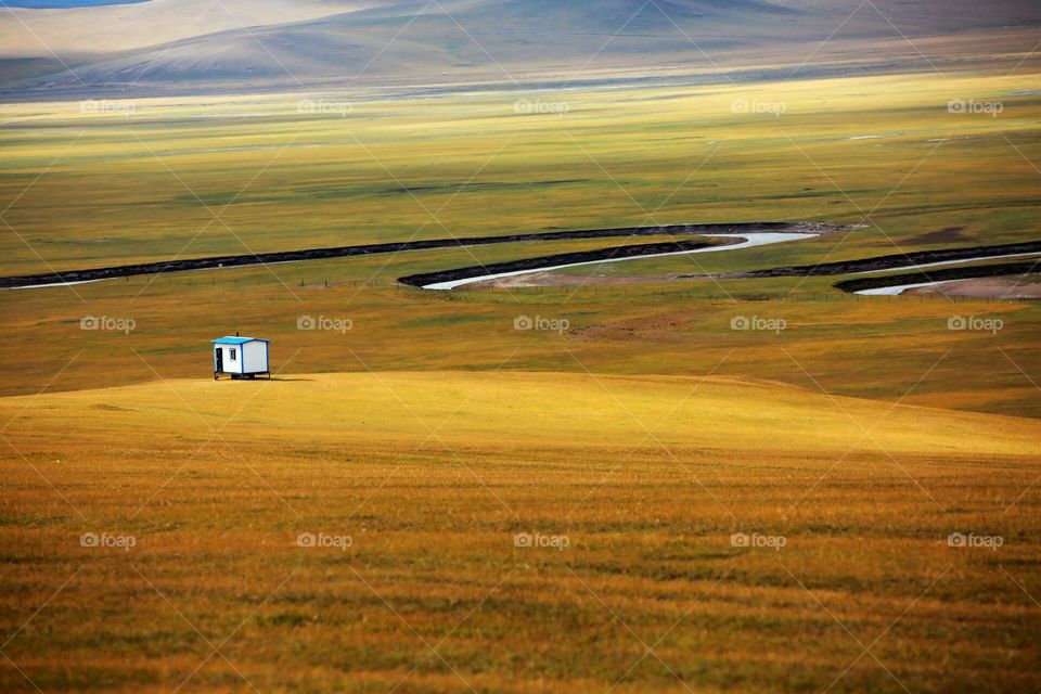 Beautiful grass ground and mountain in the fall 