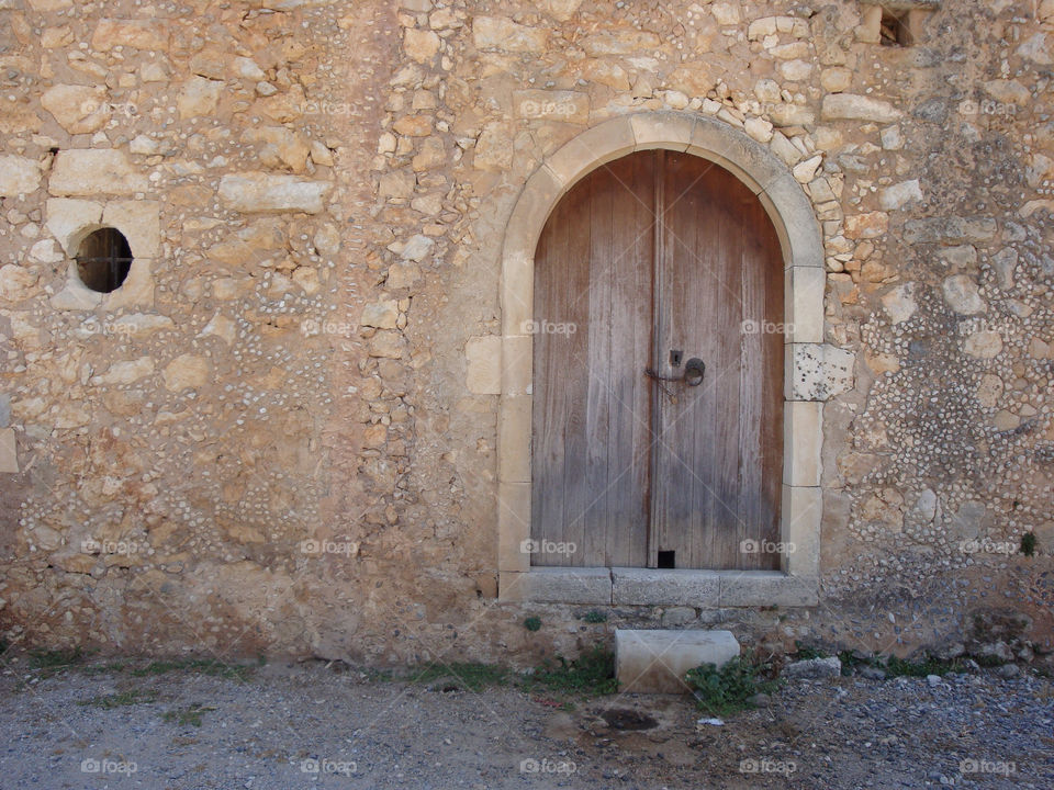 wood door stone greece by kalavrouziotis