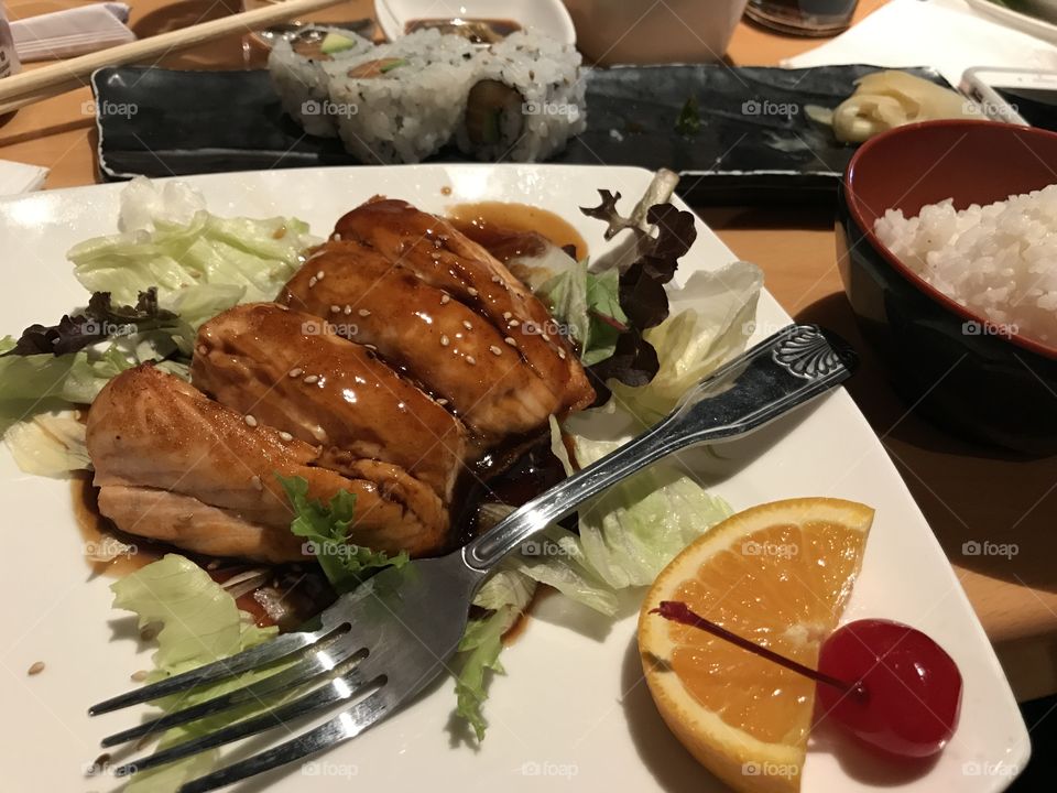 Salmon sushi dinner, with a bowl of rice at Japanese restaurant 