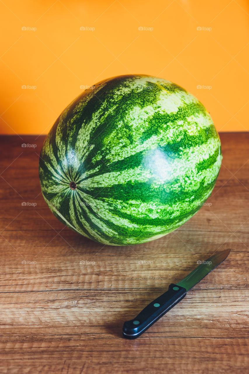 Whole watermelon on wooden table
