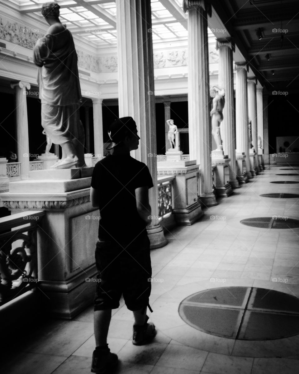 Teen boy exploring art and history museum in pittsburgh 