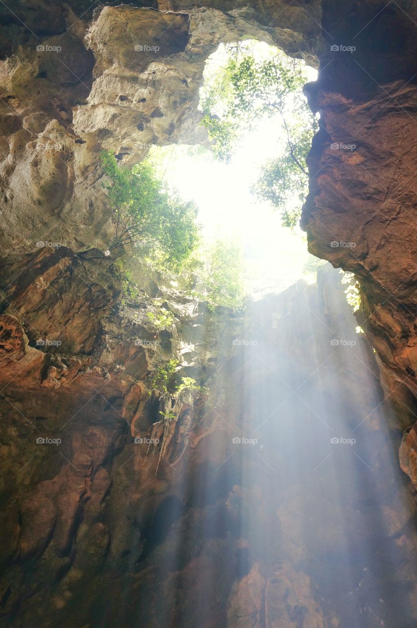 Shower of Light.. The opening at the ceiling of this cave made way for the light to come inside.