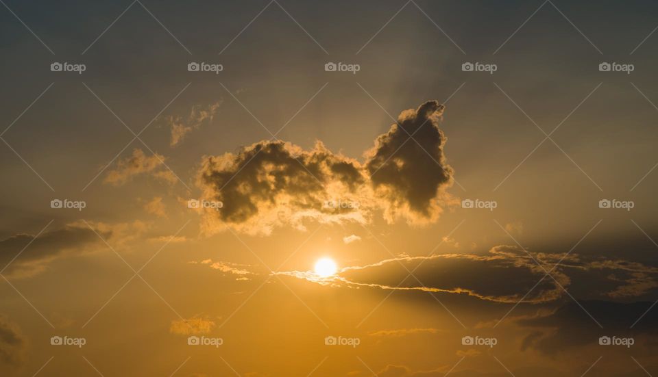 Sun and clouds during golden hour