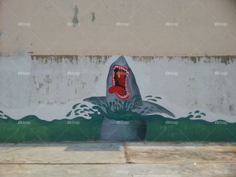 Shark Attack Mural. Thats a rubber chicken hanging at its mouth. Not part of the mural.
