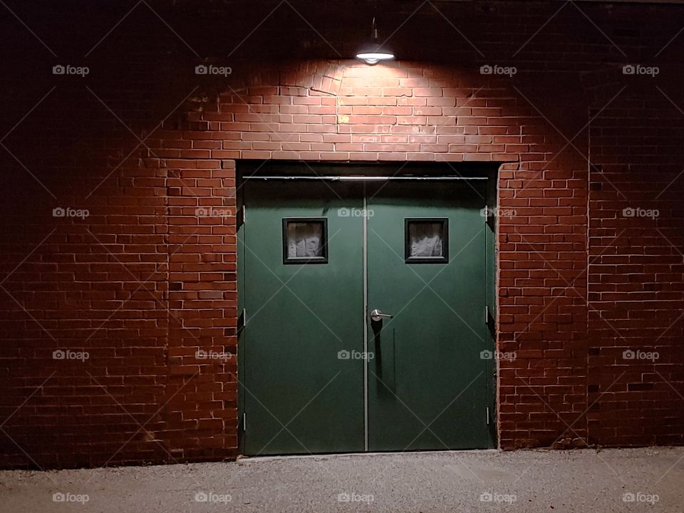 double door lit up at night