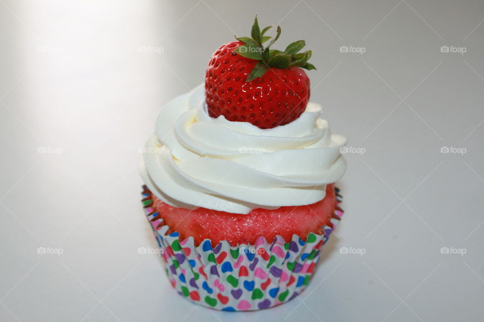 Strawberry and Jello Cupcake with Whipped Cream and Strawberry Garnish