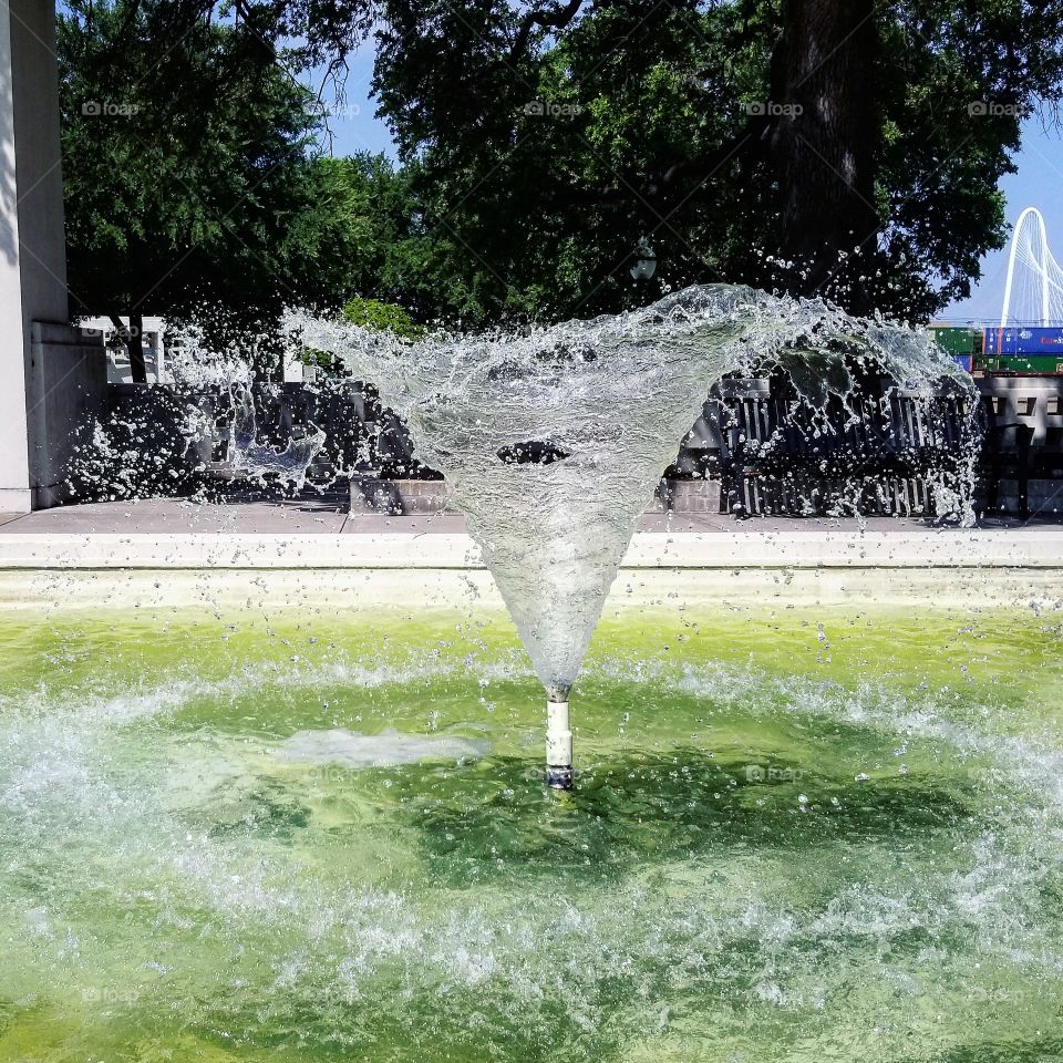 Fountain with pale green water in dealey plaza Dallas