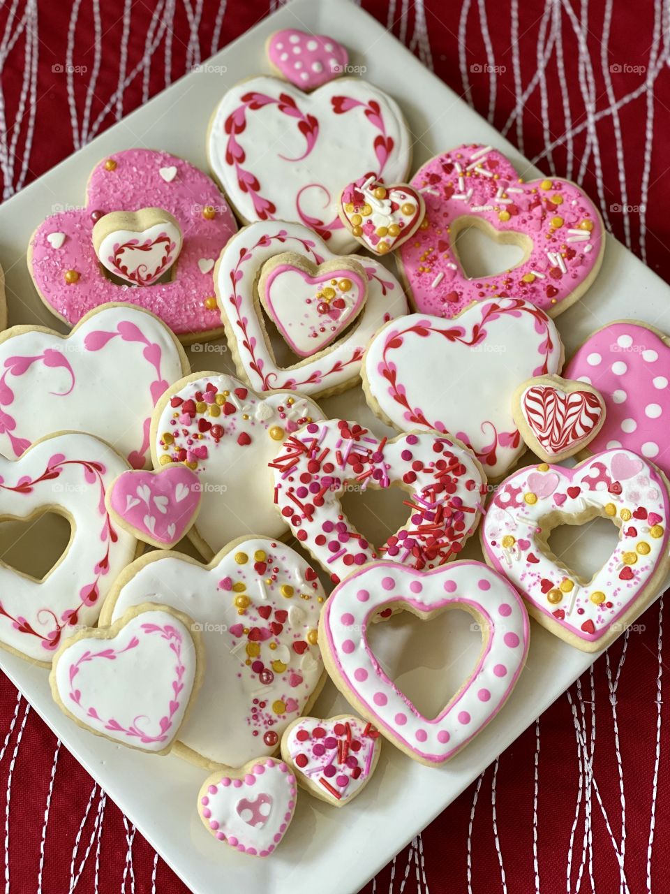 A beautiful plate of Valentine’s Day cookies frosted with royal icing.